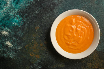 pumpkin or carrot soup (first course, delicious vegetable vitamin food) menu concept. food background. copy space. Top view