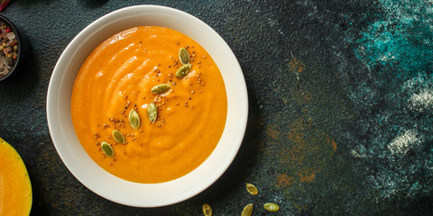 pumpkin or carrot soup (first course, delicious vegetable vitamin food) menu concept. food background. copy space. Top view