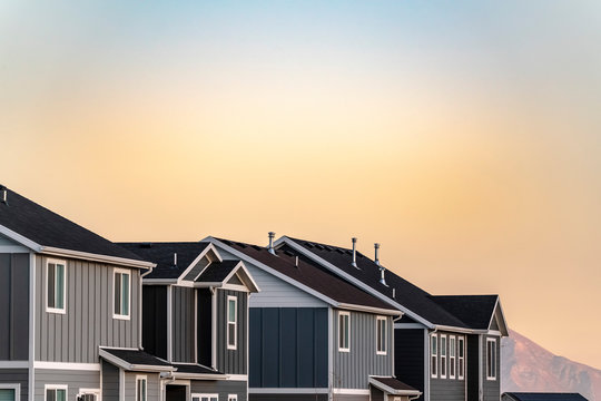 Grey timber clad houses on a housing estate