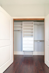 Fototapeta na wymiar Interior of an empty walk-in closet in a new house