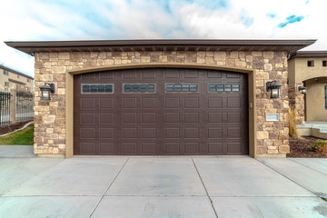 Large garage with double brown wooden door