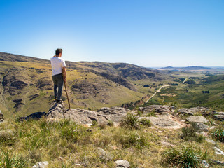 Fototapeta premium Young hiker looking at the view in Cerro Bahía Blanca