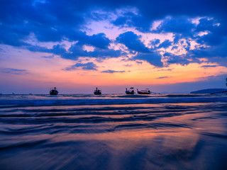 Traditional long-tail boat on the beach in Thailand