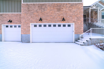 Garage forecourt covered in snow day light - obrazy, fototapety, plakaty