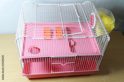 yellow hamster cage