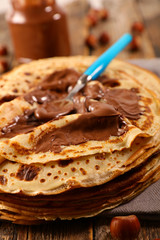 pile of french crepe with chocolate sauce