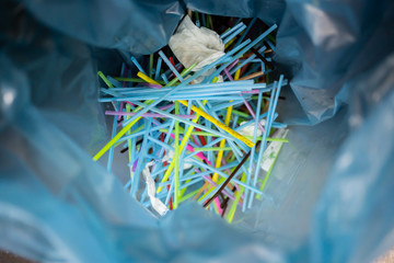 Used plastic drinking straws in a plactic bag