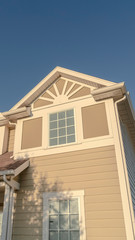 Fototapeta na wymiar Vertical Low angle view of a modern timber home