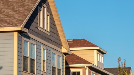 Panorama frame Upper facades of a row of timber clad houses