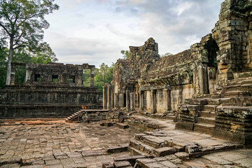 the ruined wreck of the Angkor Wat complex, sunny day, street territory and ruins, ancient steps and walls