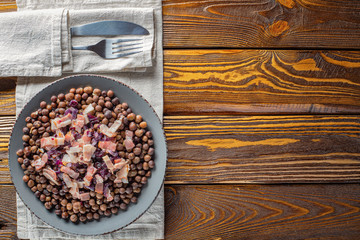 Traditional Latvia food, grey peas with bacon and onion, copy space