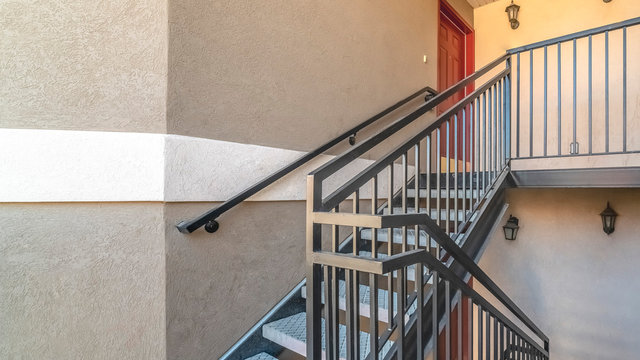 Panorama Interior stairs and landing with bannister rail