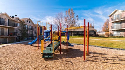 Fototapeta na wymiar Panorama Small kids playground in an urban park