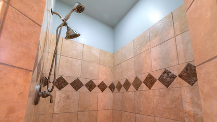 Panorama Tiled shower with decorative diamond pattern bright interior