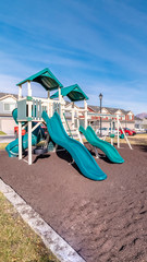 Vertical frame Colourful bright blue slides in a kids playground
