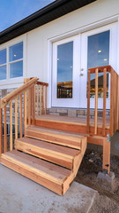 Vertical Wooden steps and deck on a modern house