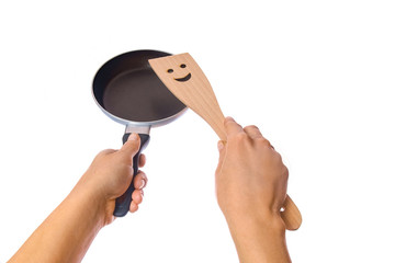 pan in hands on a white background