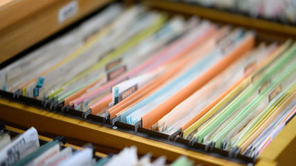 Plenty of documents placed in the office filing cabinet.