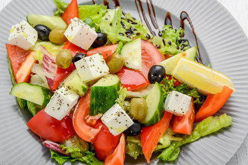 Healthy food, greek salad with vegetables and spices