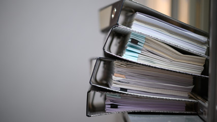 The documents in the file placed on the office desk