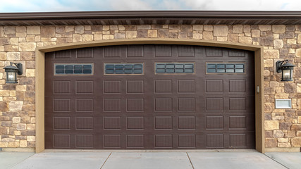 Panorama frame Large garage with double brown wooden door