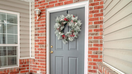 Fototapeta premium Panorama frame Christmas decorations on a front door of a home