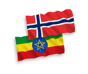 National vector fabric wave flags of Norway and Ethiopia isolated on white background. 1 to 2 proportion.