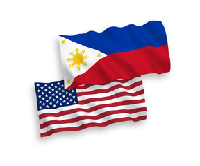 National vector fabric wave flags of Philippines and USA isolated on white background. 1 to 2 proportion.