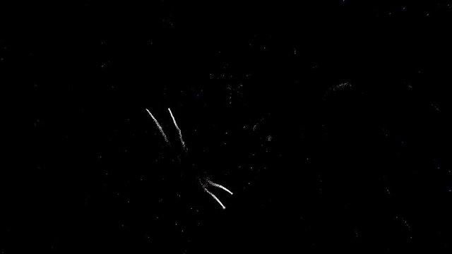 shining fireworks with bokeh lights in night sky. glowing fireworks show. New year's eve fireworks celebration. multico lored fireworks in night sky. beautiful colored night explosions in black sky