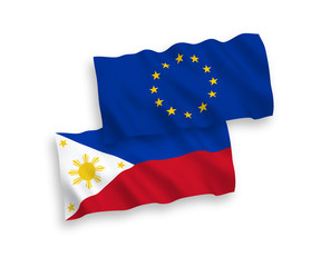 National vector fabric wave flags of European Union and Philippines isolated on white background. 1 to 2 proportion.