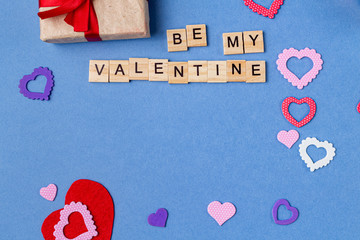Words be my valentine on the blue background. Valentine gift card background