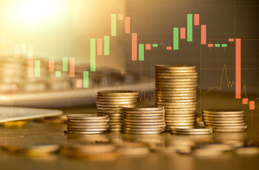 Stack of money coin with forex trading graph, financial investment concept use for background