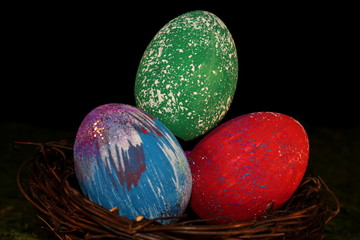 beautiful multicolored Easter eggs in a wicker basket 
