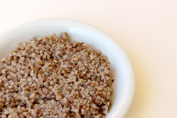 for breakfast in a plate delicious healthy friable buckwheat porridge, rich in minerals and vitamins of traditional Russian cuisine