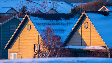 Panorama House roof covered in snow in golden evening light