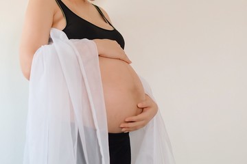 pregnant woman in white dress