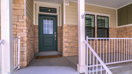 Panorama Snow covered front steps and porch day light
