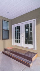 Vertical Double glass cottage pane doors opening onto patio