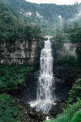 Fototapeta na wymiar Salto del Tequendama - a waterfall on the Bogotá River in Colombia. Beautiful cascading, very long waterfall in the canyon.