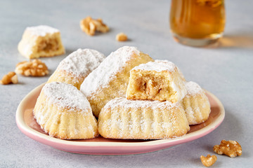 Sweet arabic pastries stuffed with walnuts . Traditional maamoul    cookies 