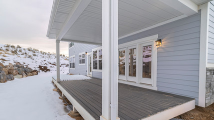 Panorama Exterior wooden covered patio in winter snow