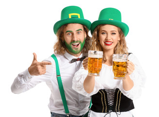 Young couple with beer on white background. St. Patrick's Day celebration