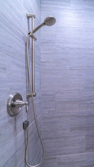 Vertical frame Tiled shower cubicle with dual heads bright interior