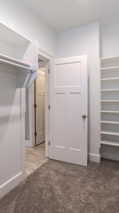 Vertical Interior of an empty walk-in closet or wardrobe