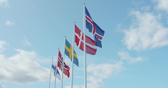 Static shot of scandinavian union flags, swedish, danish, norwegian and icelandic flapping in wind on sunny summer day. Northern countrie in economic cooperation
