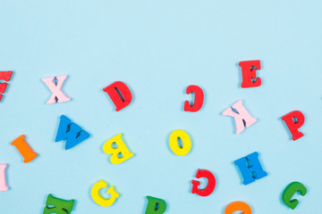 Multicolored letters on a blue background.