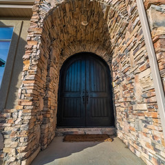 Square frame Arched door and entry passage to a house