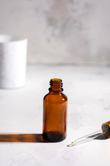 Vial of face serum essence for women. Beauty concept. High contrast