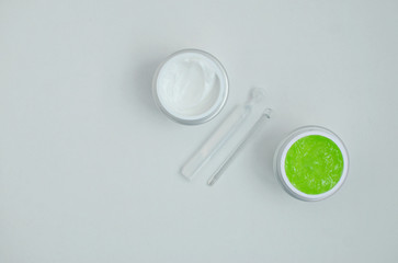 face cream, serum, aloe gel mask, on a white background, close-up