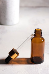 Vial of face serum essence for women. Beauty concept. High contrast